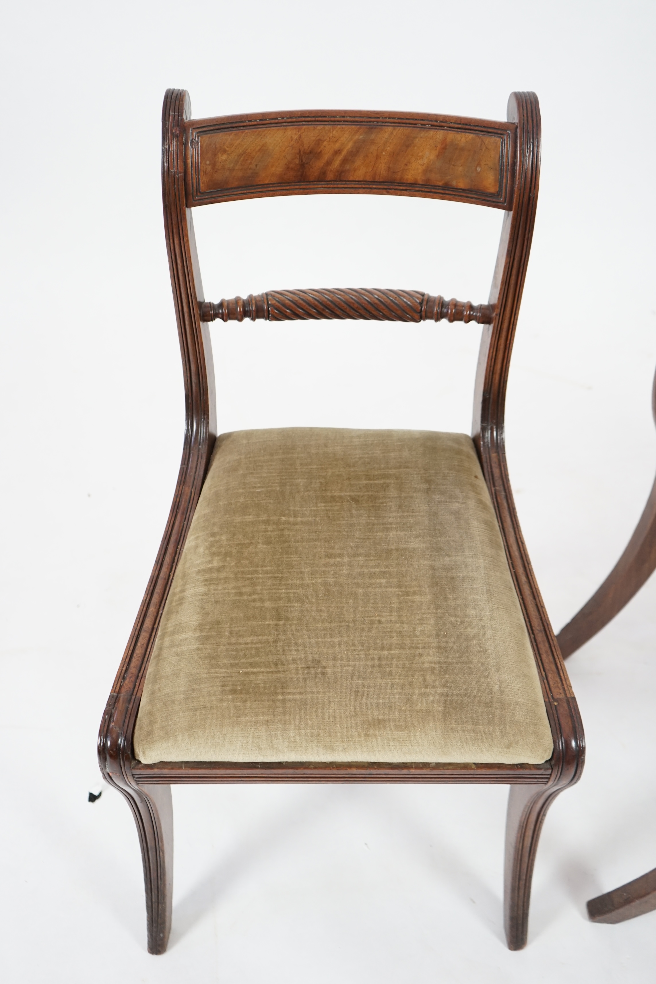 A set of ten Regency mahogany dining chairs, including a pair of carvers